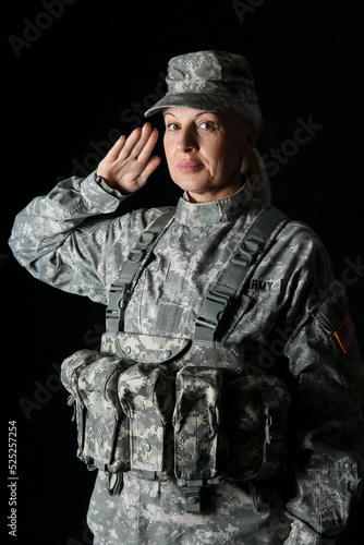 Mature female soldier salut...