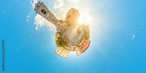 Aerial view of Porto Vecchio city roads at sunset on Corsica island of France. Drone tiny planet view of downtown skyline with tourists in restaurants, pubs, and shops in Place de la Republique square photo
