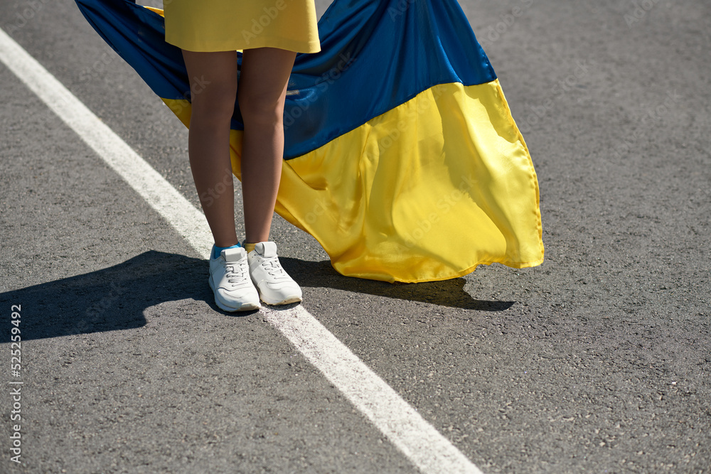 Φωτογραφία woman with the Ukrainian flag, a girl with ukrainian flag on the road, a girl wi