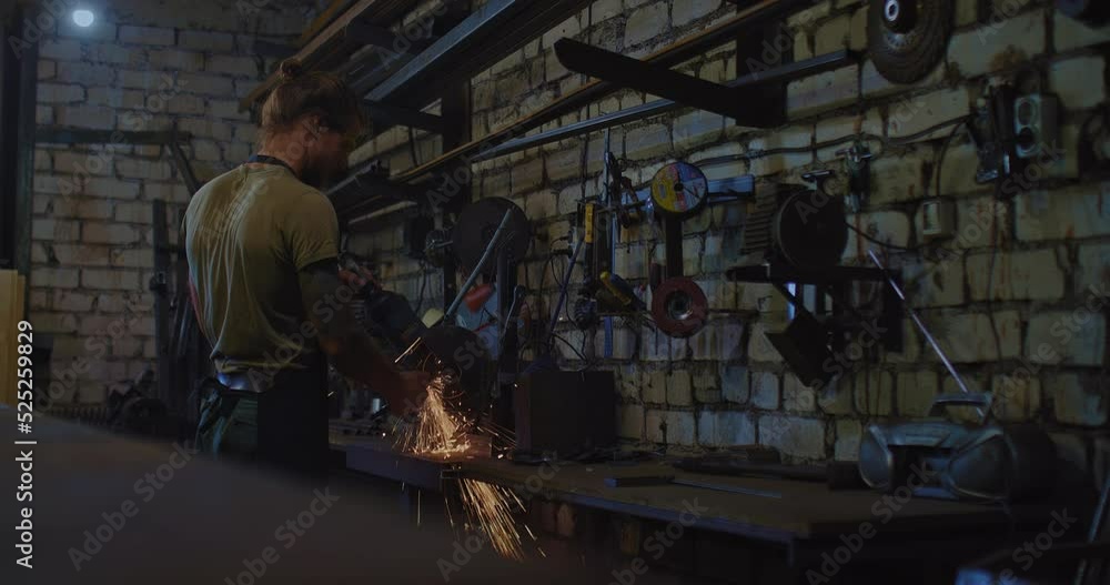 man is sawing metal billet in workshop, master of metalworking and forging, 4K, Prores man is sawing metal billet in workshop, master of metalworking and forging, 4K, Prores