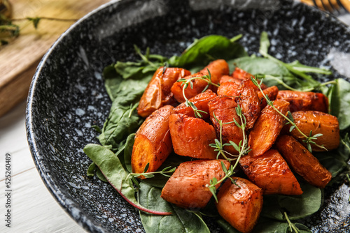 Plate of tasty baked carrot...