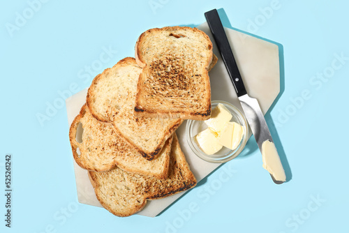 Board with toasts, bowl of ...