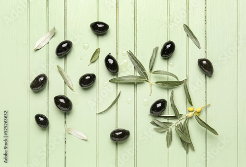 Scattered black olives, lea...