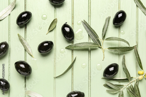 Scattered black olives, lea...