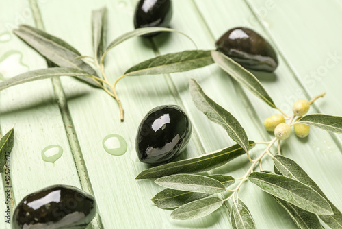 Black olives and leaves on ...