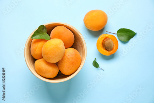 Bowl with ripe apricots on ...