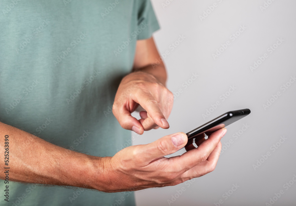 Man forefinger touching smartphone screen for tapping. Male clicking ok button. Using telephone in modern life Man forefinger touching smartphone screen for tapping. Male clicking ok button. Using telephone in modern life
