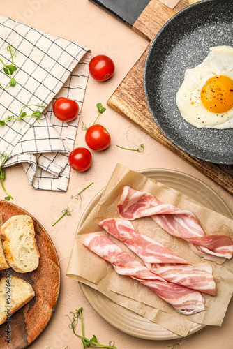 Plate with slices of raw ba...