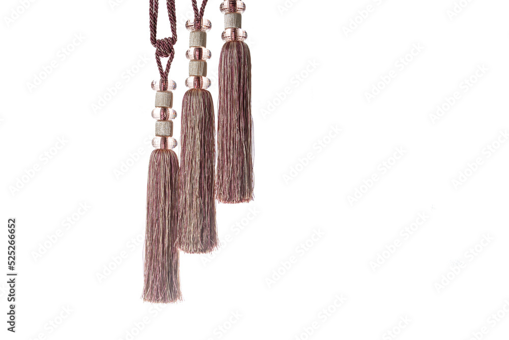 Thread tassels for curtains, tablecloths, design elements, isolated on a white background. Thread tassels for curtains, tablecloths, design elements, isolated on a white background.