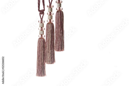 Thread tassels for curtains, tablecloths, design elements, isolated on a white background.