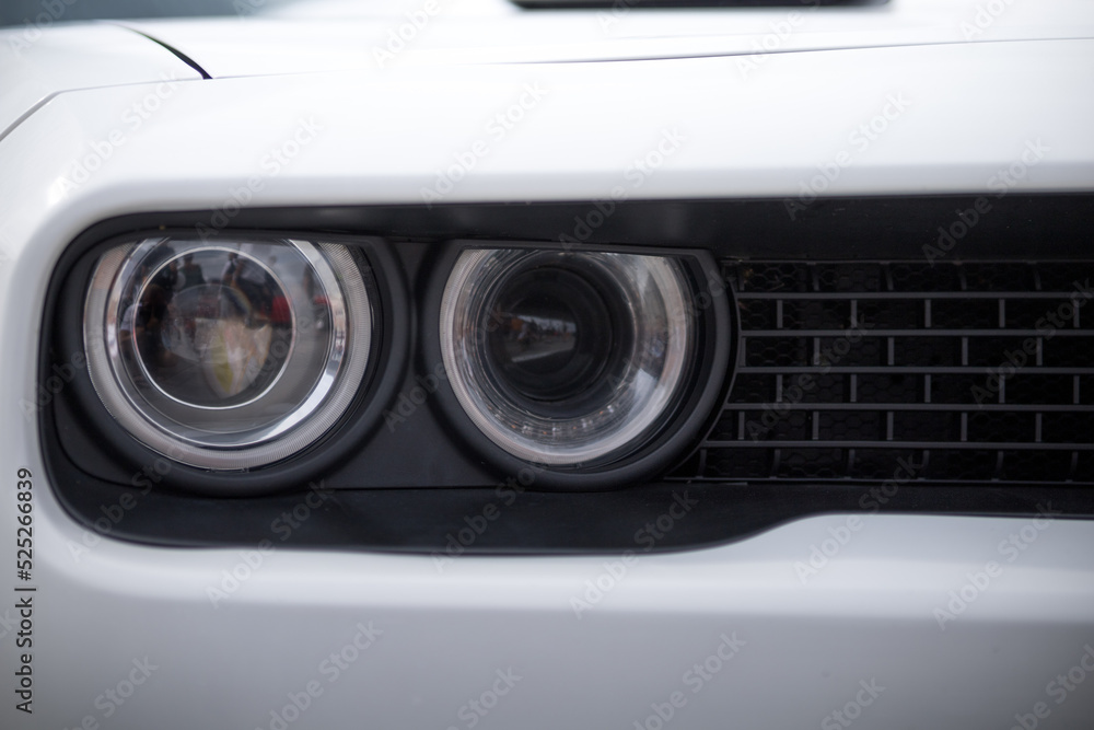 headlight of a modern prestigious white car