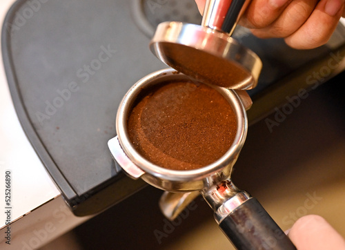 Close up hands. Barista is making coffee. (Selective Focus)