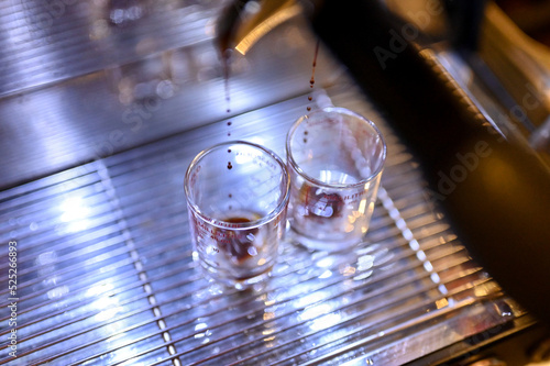 Close up Espresso machine making coffee, golden espresso flowing. Coffee espresso.(Selective Focus)