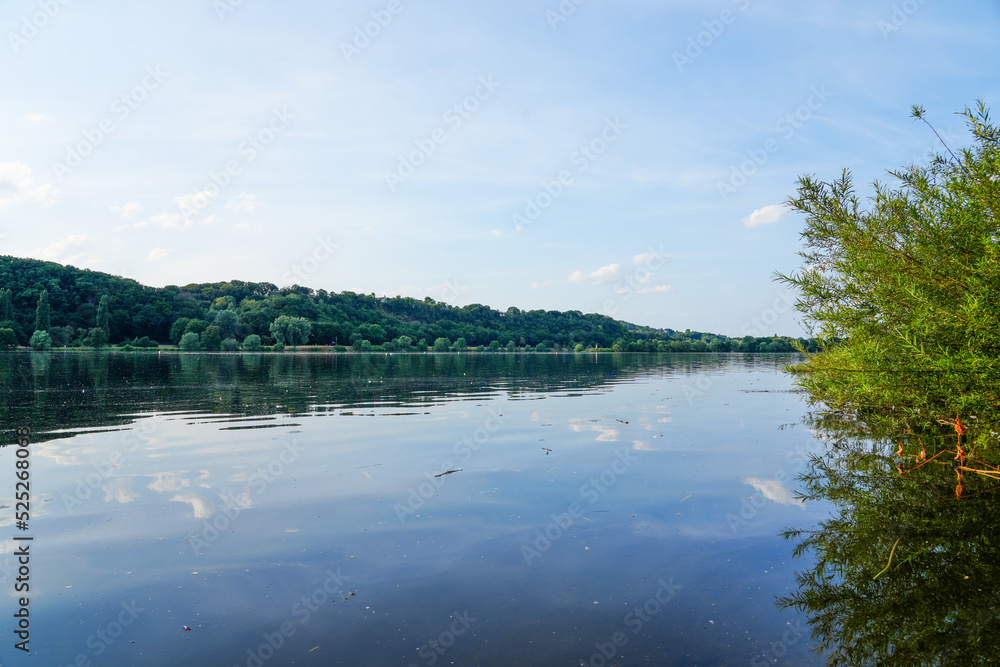 Kemnader See in the evening. Ruhr reservoir with surrounding nature. Landscape with a lake near Bochum in the Ruhr area.
Kemnader See in the evening. Ruhr reservoir with surrounding nature. Landscape with a lake near Bochum in the Ruhr area.
