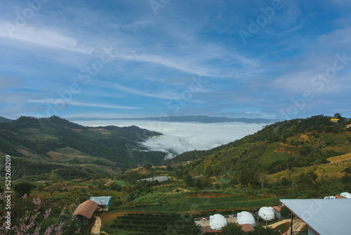 Beautiful blue sky high peak mountains mist fog wildlife green forest at changrai photo