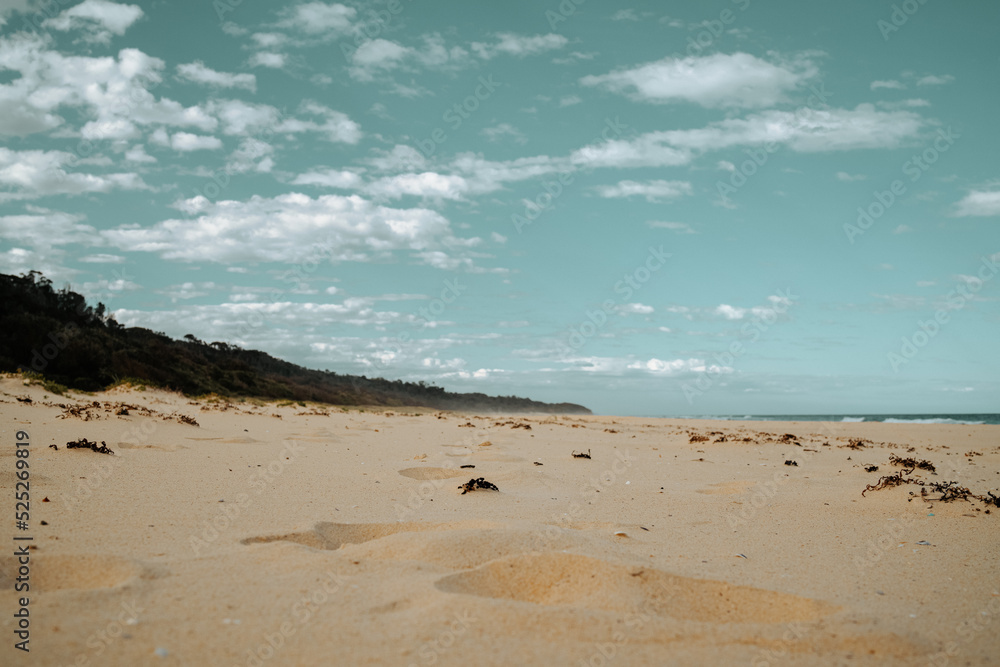 Long empty beach on cloudy day