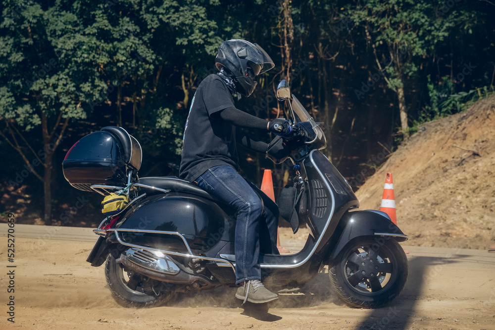 Fototapeta premium motorcycle on the road rides away. Travel on vacation, enjoy the nature trail