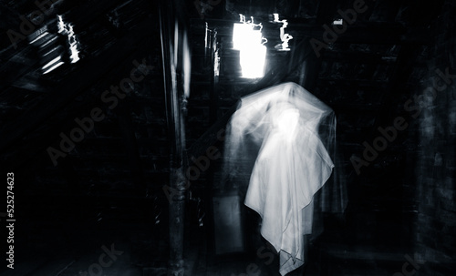 Fotografie blurred image of ghost in the attic haunted house for Halloween