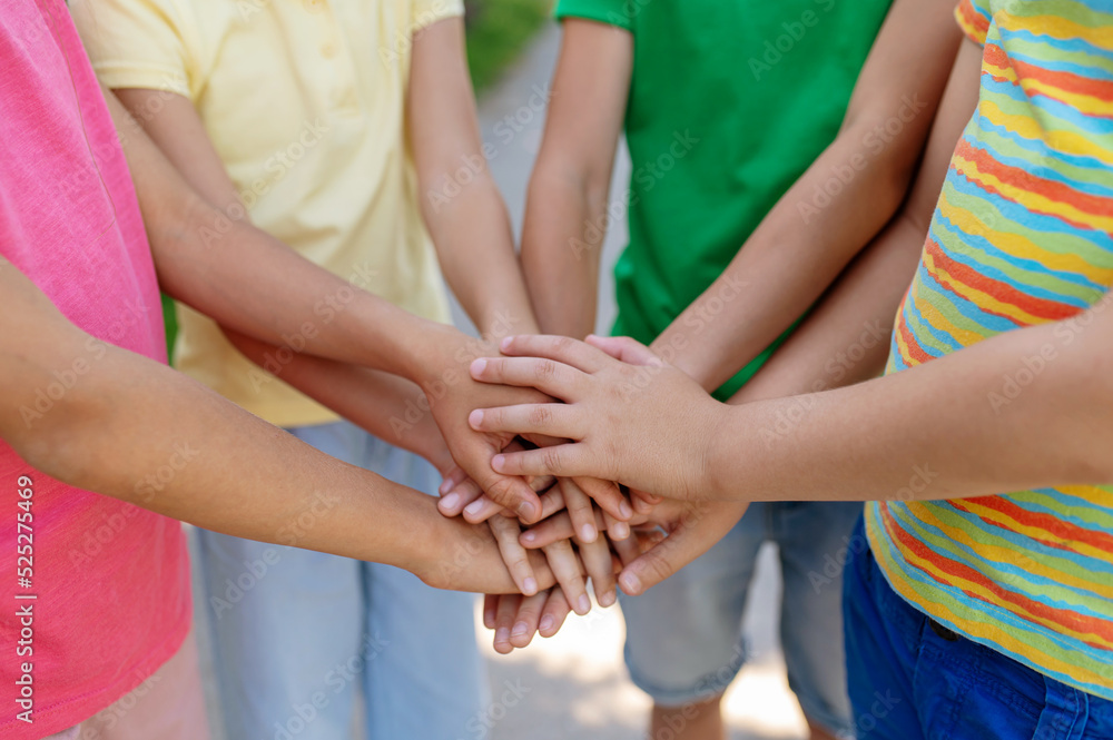 Children standing in circle with palms outstretched Children standing in circle with palms outstretched