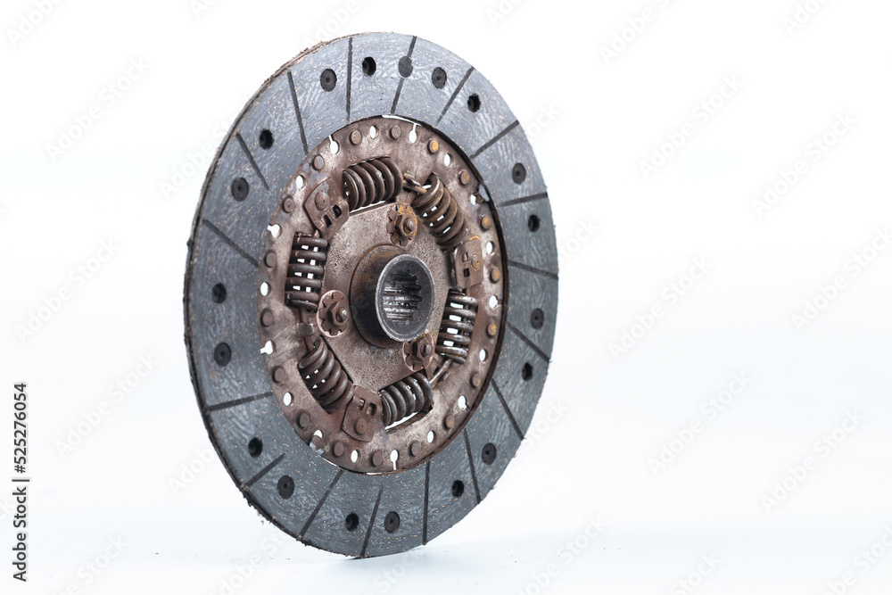 Old and worn clutch plate disc viewed from different angles. Clutch plate on wear limit, loose springs, isolated on white.