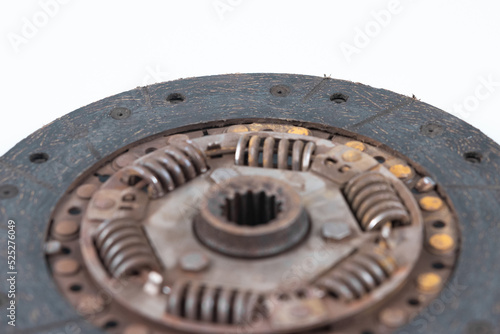 Old and worn clutch plate disc viewed from different angles. Clutch plate on wear limit, loose springs, isolated on white.