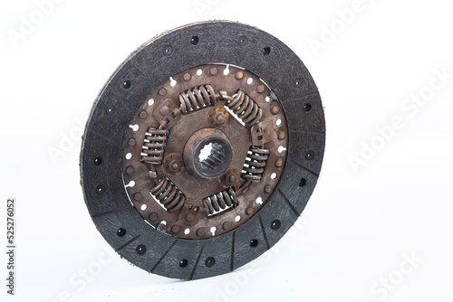 Old and worn clutch plate disc viewed from different angles. Clutch plate on wear limit, loose springs, isolated on white.
