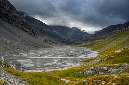 L  mmerenboden with meandering creek and wildstrubel glacier in the distance in valais
