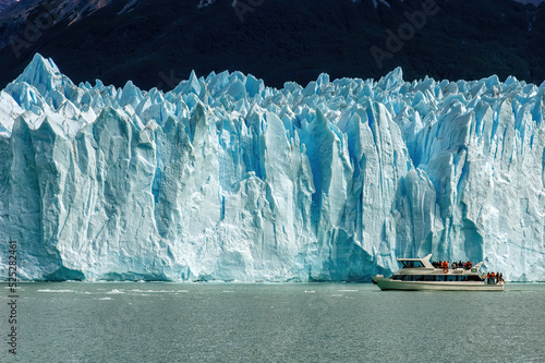 Cruise boat in front of Perito Moreno Glacier in Patagonia, Argentina.