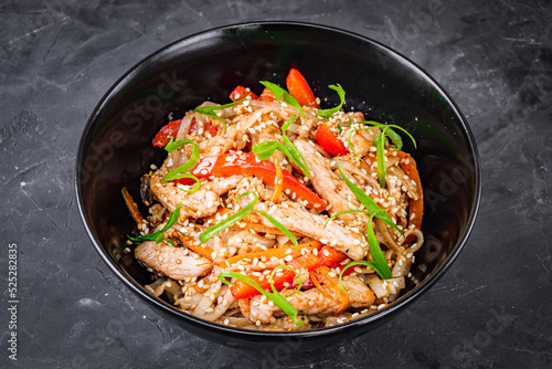 delicious chinese fried noodles on a black background