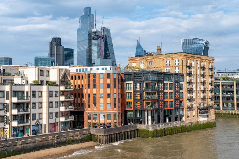 London, England: City skyline seen from the Millenium bridge, looking toward Financal District