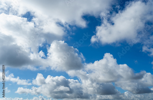 Fototapeta Naklejka Na Ścianę i Meble -  Clear blue sky and white clouds. Air clouds in the blue sky. Beautiful white cloud on clear blue sky as nature concept. Abstract style for text, design, pattern, background