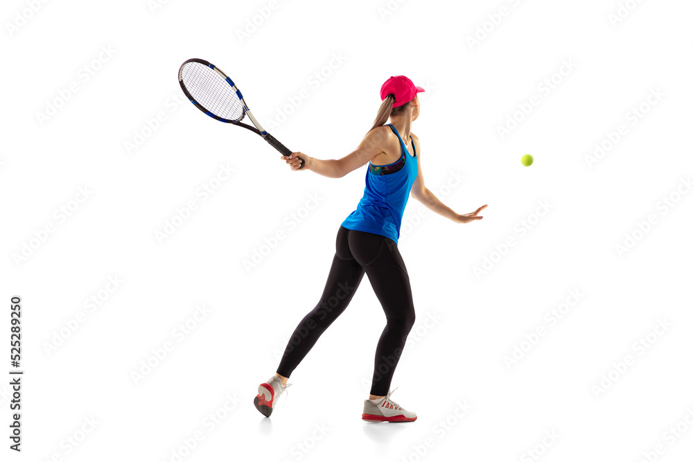Young sportive woman, tennis player playing tennis isolated on white background. Healthy lifestyle, fitness, sport, exercise concept.