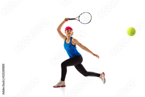 Young sportive woman, tennis player playing tennis isolated on white background. Healthy lifestyle, fitness, sport, exercise concept. © master1305