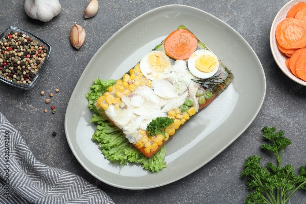Delicious fish aspic served on grey table, flat lay Delicious fish aspic served on grey table, flat lay