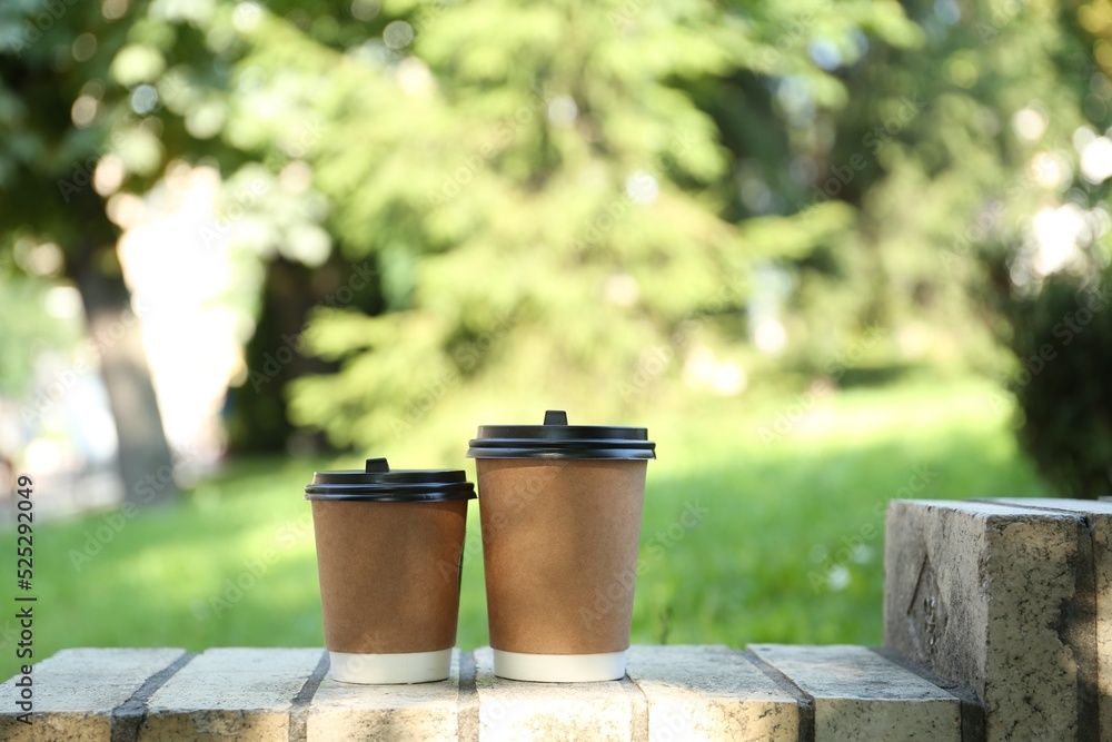 Paper cups on street outdoors. Takeaway drink Paper cups on street outdoors. Takeaway drink
