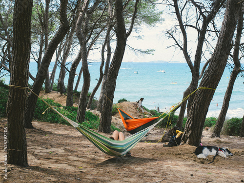 person in hammock on the beach