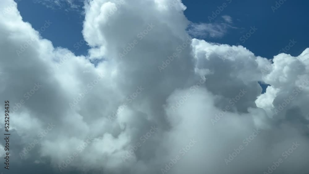 Impressive view from a jet cockpit flying at 12000 metres high while penetrating some very high stormy clouds. Pilot POV. 4K 60fps. Impressive view from a jet cockpit flying at 12000 metres high while penetrating some very high stormy clouds. Pilot POV. 4K 60fps.