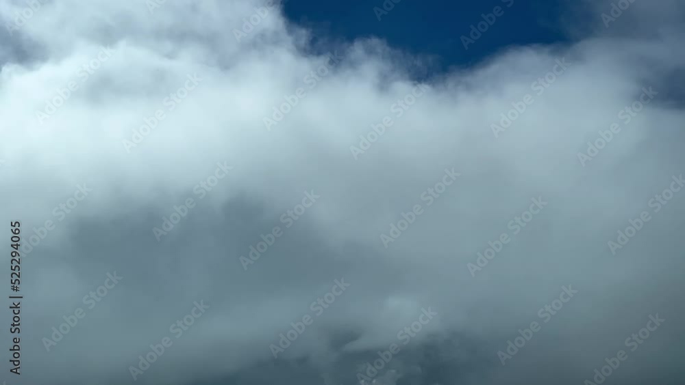 Unique cockpit view, Pilot POV while flying through some stormy clouds, avoiding the top of a cumuloninmbus, at 12000 metres high. 4K 60fps. Unique cockpit view, Pilot POV while flying through some stormy clouds, avoiding the top of a cumuloninmbus, at 12000 metres high. 4K 60fps.