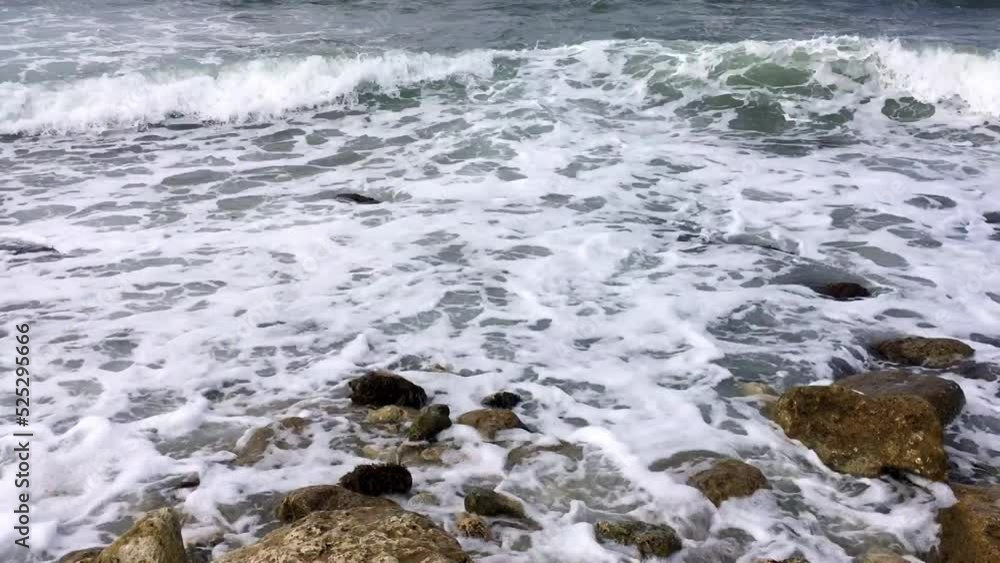 Beautiful blue sea waves crash against the shore. Beautiful blue sea waves crash against the shore.