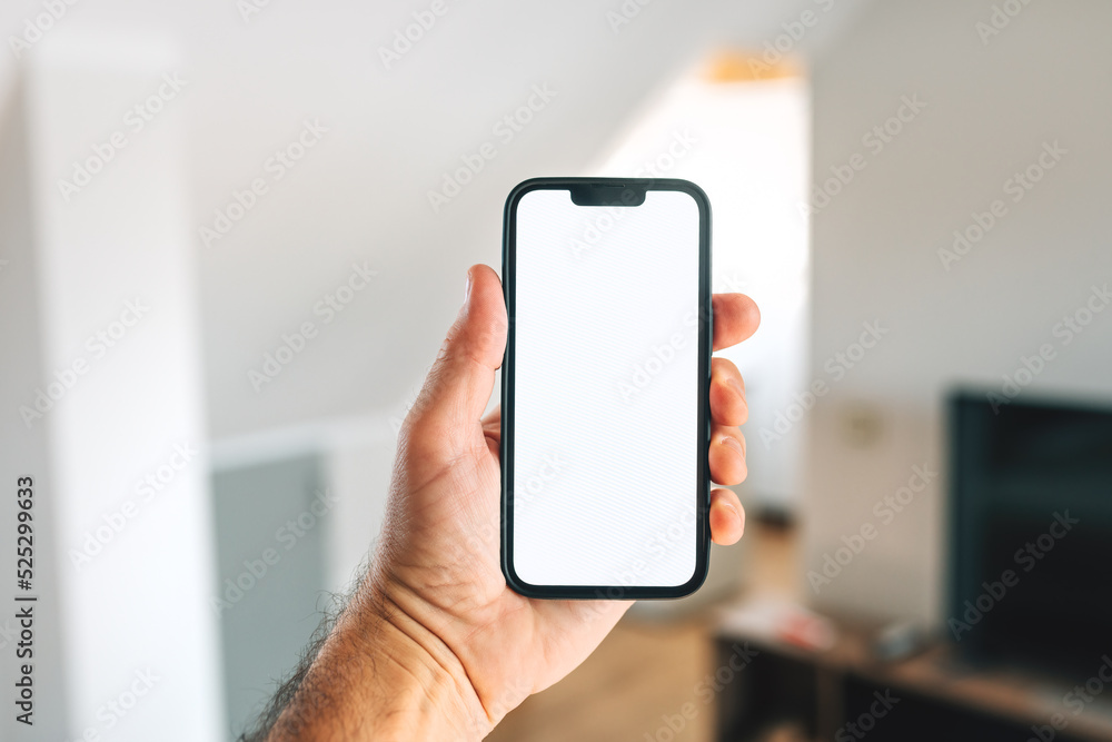 Smartphone mockup, internet of things and smart home concept, man using mobile phone Smartphone mockup, internet of things and smart home concept, man using mobile phone