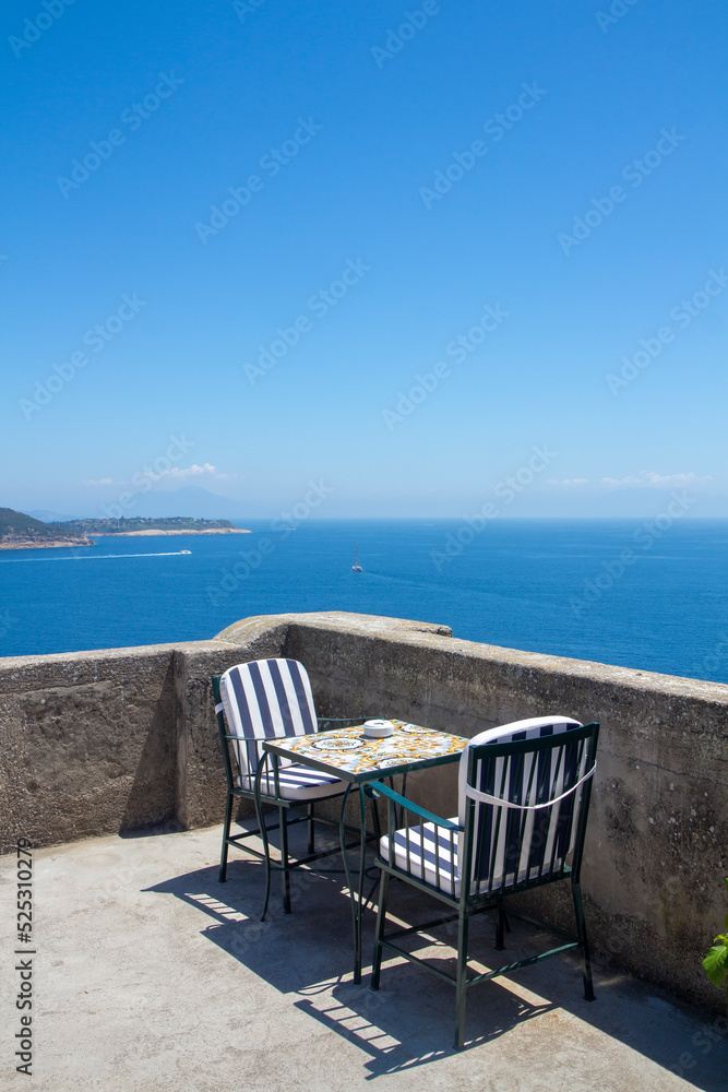 Fototapeta premium coffee table with sea view in Ischia Ponte