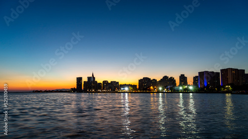 Beautiful sunset over the city in Mavişehir, the day is ending and the sunset gives peace with its magnificent colors. Romantic sunset concept. Selective focus, noise effect and grainy texture.