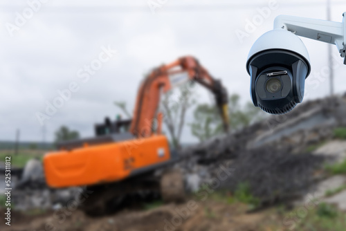 CCTV camera watching an excavator and workers working on a construction site