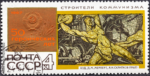 USSR - CIRCA 1967: a post stamp printed in the USSR shows picture Builders of communism by D.M.Merpert and Y.N.Skripkov, devoted 50 heroic years.