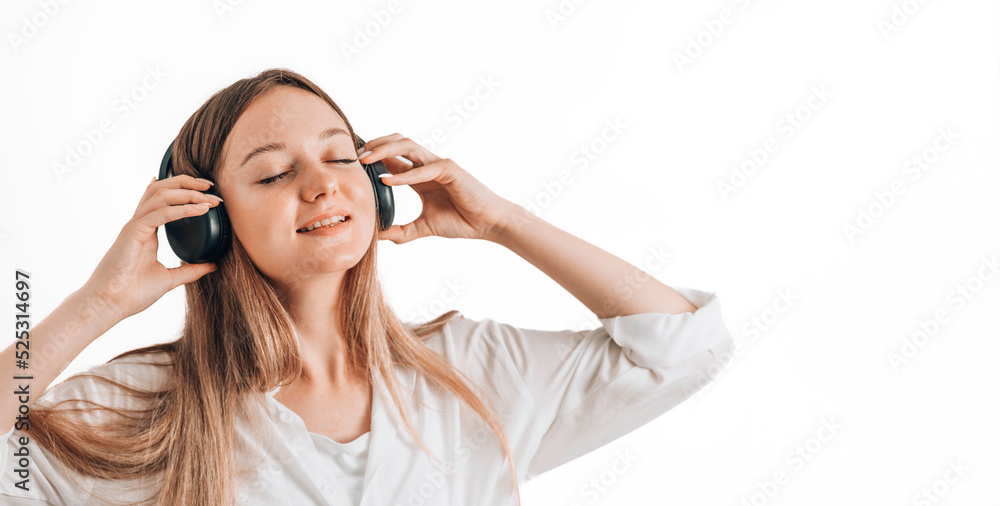 Pretty young woman girl on white isolated background studio portrait. People emotions lifestyle concept. Mock up copy space. Listen music Pretty young woman girl on white isolated background studio portrait. People emotions lifestyle concept. Mock up copy space. Listen music