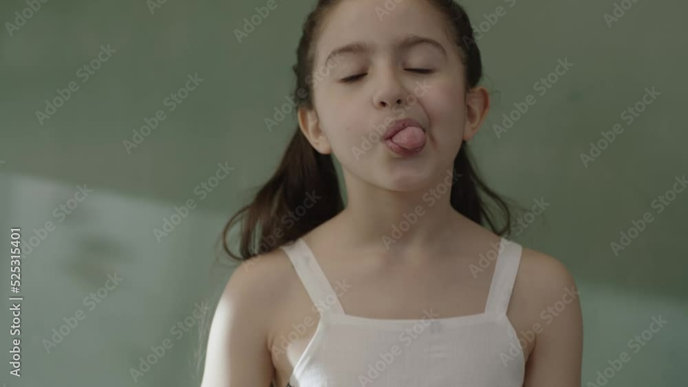 A girl's mouth is a trait inherited from her parents, with her