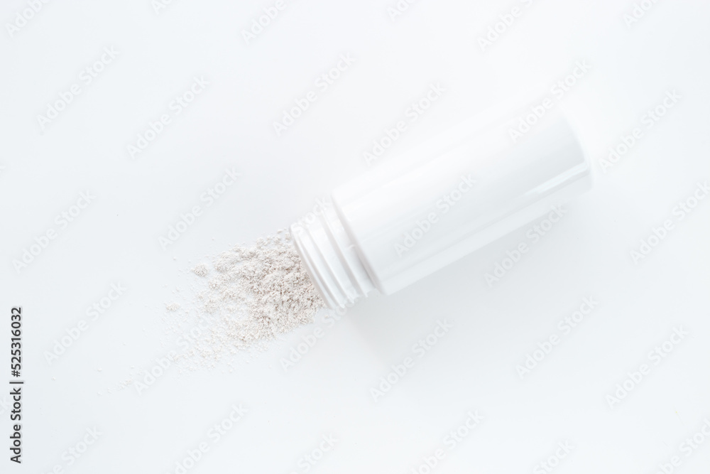 Skin care with talcum powder in container. Spilled white powder Skin care with talcum powder in container. Spilled white powder