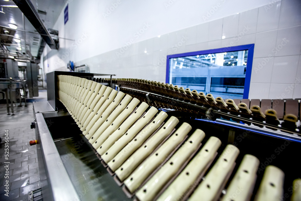 Fototapeta premium Production of plastic bottles. Factory automated industrial line for bottling