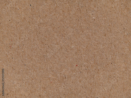 Texture of brown kraft paper, paper background. Macro of a sheet of paper, background texture. Close-up paper surface structure