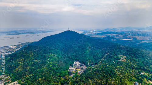 Aerial photography of smog and industrial pollution shrouded in Qixia Mountain, the Yangtze River and busy transport ships in Nanjing City, Jiangsu Province, China